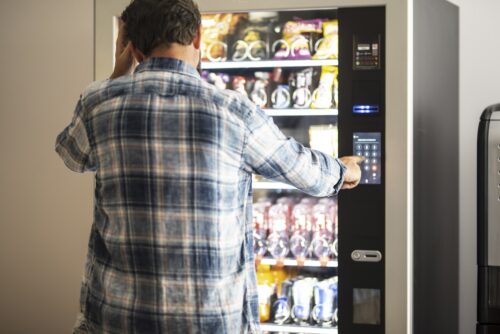 man frustrated after following vending machine tips