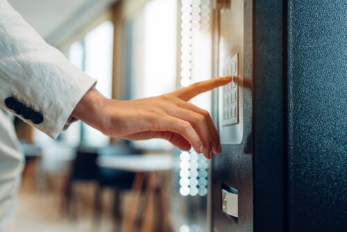 woman getting food at office vending machine